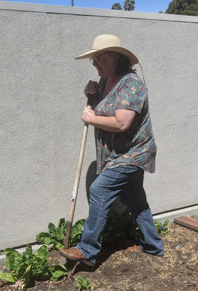 a woman with a shovel